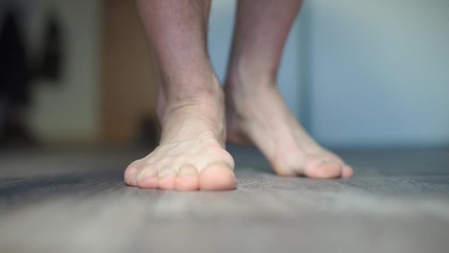 Close-up of the legs of a man. 