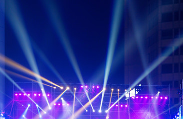 multiple spotlights on a theatre stage lighting rig