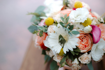 beautiful wedding bouquet with red, pink and white flowers, roses and eucalyptus, peonies, calla lilies