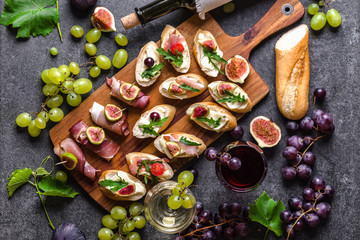 Mediterranean snack for wine. Traditional tapas bar, spanish table with food, platter with appetizer or italian bruschetta.