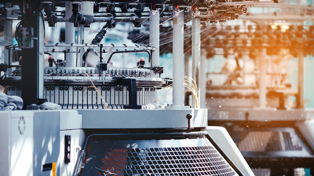 Textile Manufacturing. Circular knitted fabric. Textile factory in spinning production line and a rotating machinery and equipment production company. Clothing industry. Manufacturing textile fabrics.