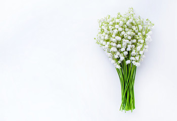 Bouquet of lilies of the valley on a white background, Top view, copy space