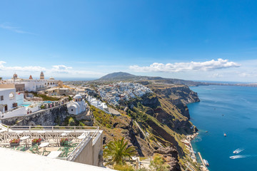 Fototapeta na wymiar White architecture and amazing sea view from caldera. Fantastic summer vacation and travel destination scenic. Beautiful landscape, picturesque nature background