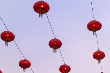 Red Chinese new year lanterns circular shaped with twilight sky background.