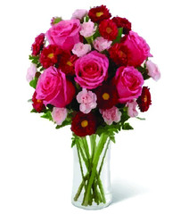 A bouquet of light roses in a vase on a white background