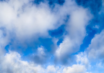 Beautiful mixed cumulus and cirrus clouds on a blue sky in summer