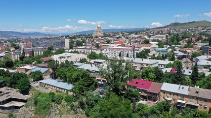 Fototapeta na wymiar Aerial view of Tbilisi Old Town. old georgian houses, buildings. Holy Trinity Cathedral of Tbilisi. Church. Georgia.