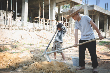 Concept of poverty and child labor, Children who are working on construction sites ,  Against child...