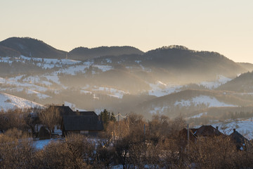 A Beautiful Sunset Mist Enveloping the Mountains and the Village