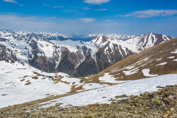 Fototapeta na wymiar Snow-capped peaks of the Caucasus Mountains. Karachay-Cherkessia, Russia