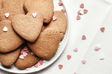 Delicious homemade cookie hearts  on a light background. Top view. Place for text.