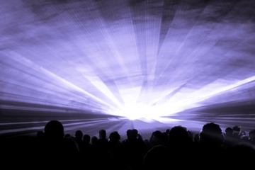 Purple laser show nightlife club stage with party people crowd. Luxury entertainment with audience silhouettes in nightclub event, festival or New Years Eve. Beams and rays shining colorful lights