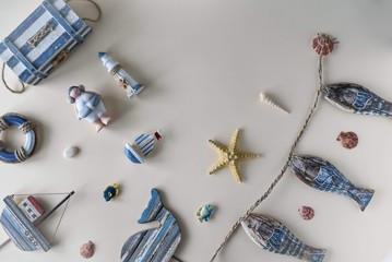 Nautical life style items: sea shells, fish, rope, lifebuoy. Marine concept.