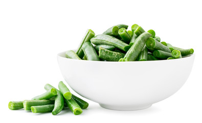 Slices of green beans in a plate close-up on a white background. Isolated