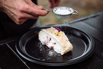 Meringue roulade with cream. 