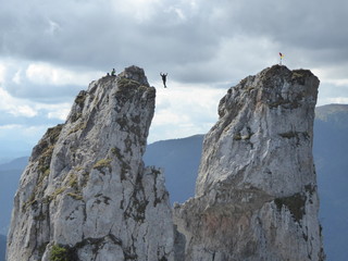 Practicing highline sports between rocky mountains, walking on a thin line