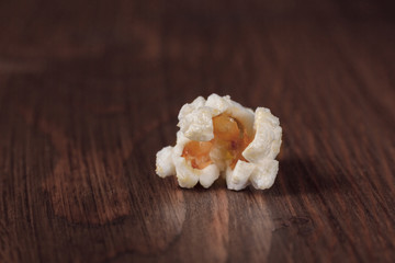 Popcorn close-up on a wooden background
