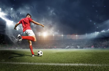 Fotobehang Football player in the stadium © efks