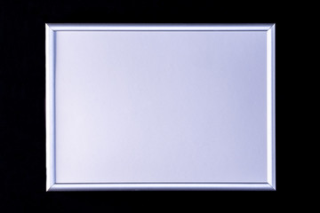 Silver frame with white insert on a black background.