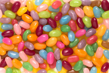 Close up assorted colourful jelly beans candy background. Top view