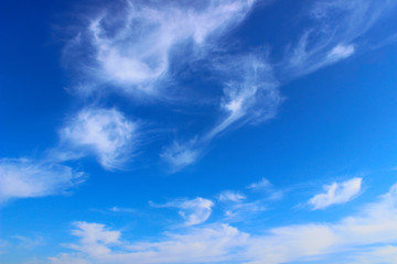 Naklejka na ściany i meble Blurry image of cloudy sky. Blue sky and white clouds. Colorful nature background.