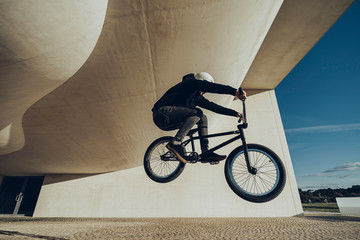 Unknown bmxer making a bunny Hop