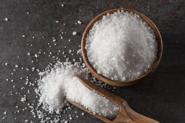 Crystaline sea salt in bowl and spoon - closeup