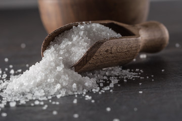 Crystaline sea salt in bowl and spoon - closeup