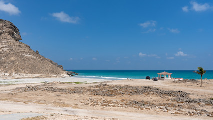 Fototapeta na wymiar nice view on the Mughsail Beach, Salalah Oman. Fantastic seascape of Indian Ocean. Great outdoor scene of Beauty of nature concept background, blue sea, blue sky, few clouds, light sandy beach