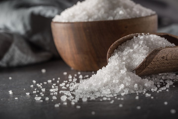 Crystaline sea salt in bowl and spoon - closeup