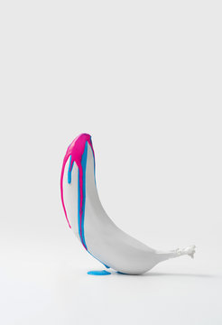 abstract image on the topic of sexually transmitted diseases. white banana on a white background with colored drips.