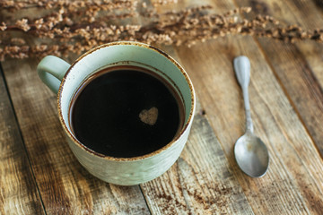 In a Cup of coffee foam in the shape of a heart