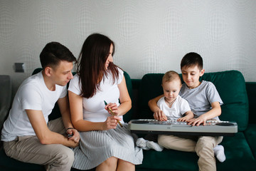 Caucasian family plays musical instruments