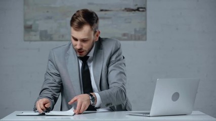 awoke businessman making online bets in office