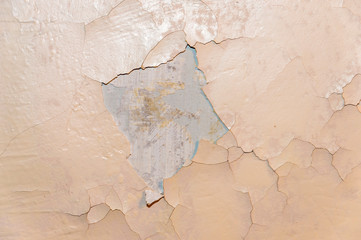 Old collapsing painted and plastered wall
