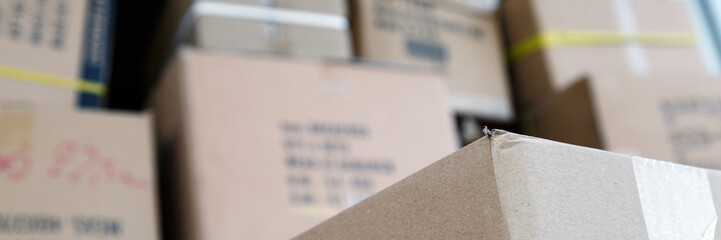 Pile of brown cardboard boxes at warehouse of market