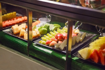 Selective Focused Fruit Cart Selling Fresh Assorted Tropical Asian Seasonal Fruit (guava, dragon fruit, papaya, cantaloupe). Vegetarian and Vegan Food, Organic Fruit, Nutrition and Health care concept