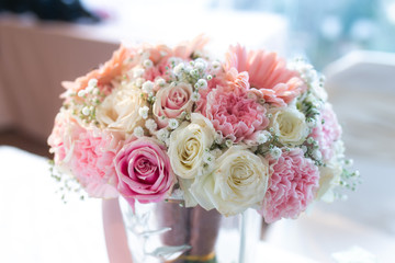 Blooming fresh flower bouquet on reception table background. Decorative Ornamental Flower, Nature, Valentine Day, Home Decoration, Bridal Wedding Reception, Floral Arrangement and Interior concept