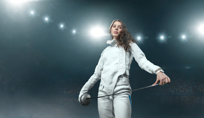 Female fencer on professional sports arena.