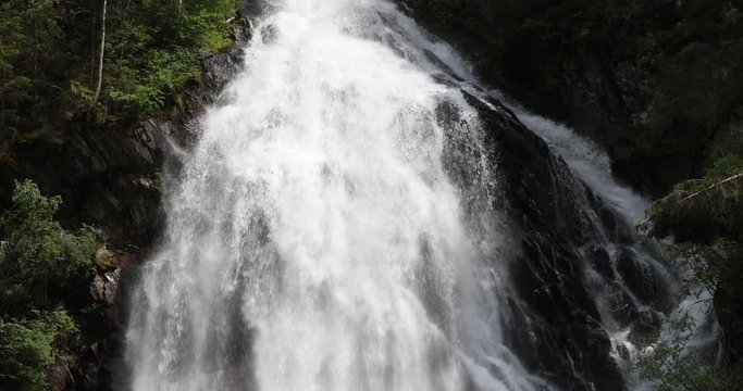 Tilt down shot of the Schleierfall (veil fall), a huge waterfall in the Hohe Tauern nature reserve in the Austrian Alps in the valley of Kals am Gro&szlig;glockner.