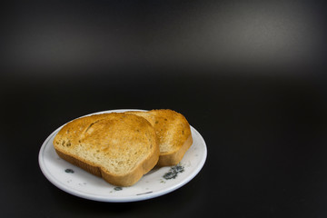Toasted bread lies on a saucer
