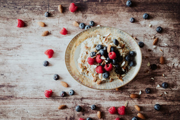 Porridge bowl, oat meal with blueberries, raspberries and   almond splits