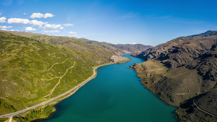 Blue river inside a valley aerial view panorama