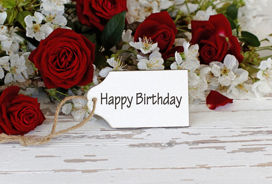 Label with the text happy birthday and red roses