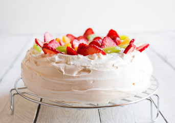 Delicious Pavlova cake with meringue and fresh strawberries