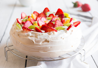 Delicious Pavlova cake with meringue and fresh strawberries
