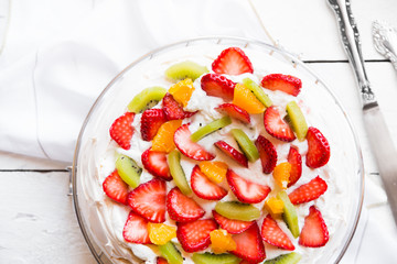 Delicious Pavlova cake with meringue and fresh strawberries