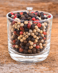 Pepper mix  on wooden background.