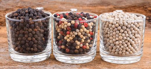 Pepper mix  on wooden background.
