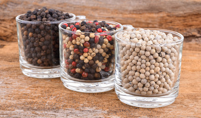 Pepper mix  on wooden background.